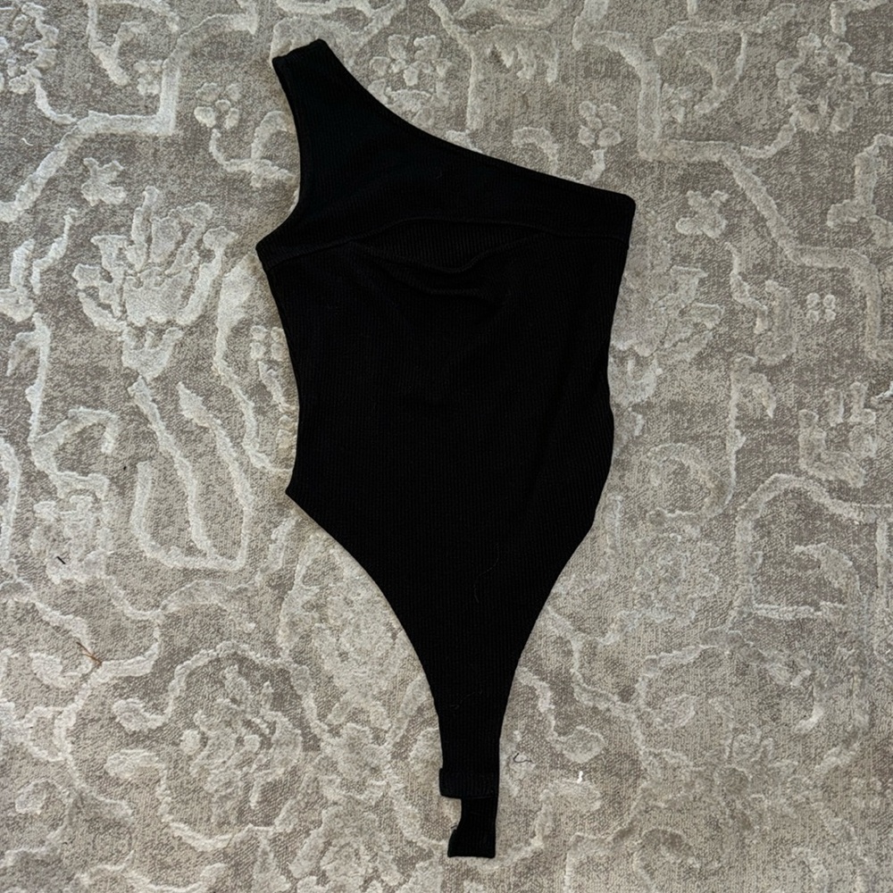 Black one shoulder body suit